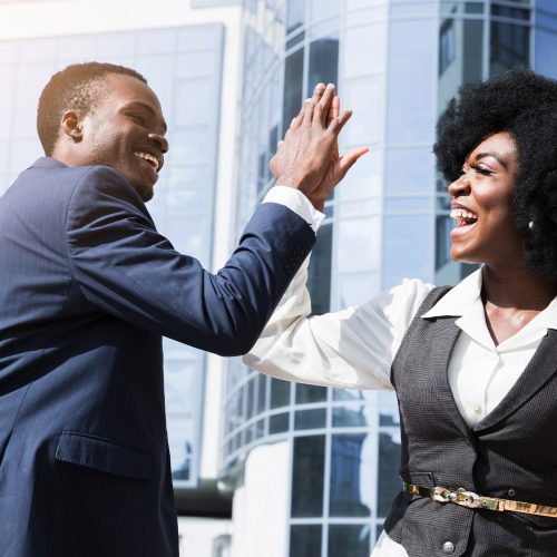 afro-man-and-woman-high-fiving