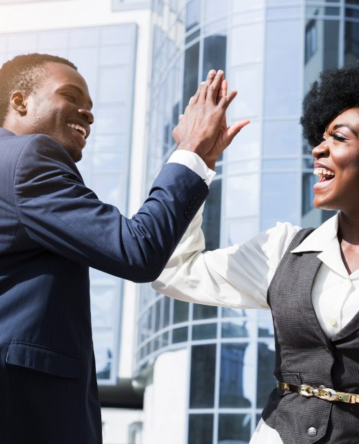 afro-man-and-woman-high-fiving