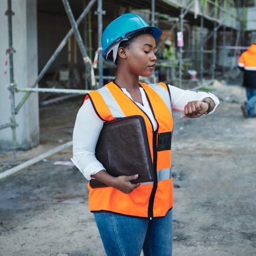 young-female-worker-looking-at-a-watch